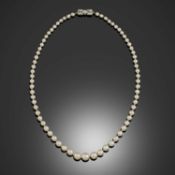 A SINGLE ROW NATURAL PEARL NECKLACE
