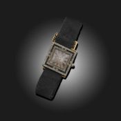 CARTIER, AN ART DECO ONYX AND DIAMOND WRISTWATCH
