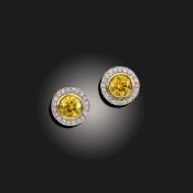 A PAIR OF ORANGE DIAMOND AND DIAMOND CLUSTER EAR STUDS