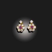 A PAIR OF RUBY AND DIAMOND CLUSTER EARRINGS