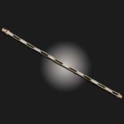 A DIAMOND SIMULANT-SET GOLD BRACELET