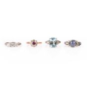 A COLLECTION OF FOUR GEM-SET RINGS IN PLATINUM OR GOLD