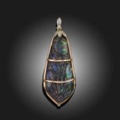 A CARVED BOULDER OPAL PENDANT