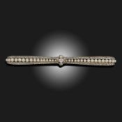 AN EDWARDIAN SEED PEARL AND DIAMOND BOW BROOCH