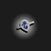 A SAPPHIRE AND DIAMOND CLUSTER RING