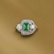 AN EMERALD AND DIAMOND RING
