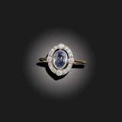 A SAPPHIRE AND DIAMOND CLUSTER RING