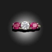 A RUBY AND DIAMOND THREE STONE RING, C1975