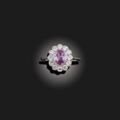A PINK SAPPHIRE AND DIAMOND CLUSTER RING