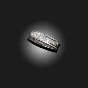 A DIAMOND HALF-HOOP RING