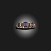 A GEORGE III AMETHYST THREE STONE RING