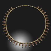 A RUBY AND SEED PEARL-SET GOLD FRINGE NECKLACE