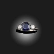 A SAPPHIRE AND DIAMOND THREE STONE RING