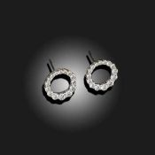 A PAIR OF DIAMOND HOOP EARRINGS