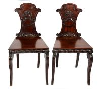 A PAIR OF REGENCY MAHOGANY HALL CHAIRS