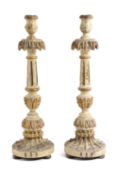 A PAIR OF ITALIAN PAINTED AND OF GILTWOOD CANDLESTICKS