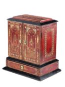 A TOOLED AND GILT DECORATED LEATHER BOUND STATIONERY CABINET
