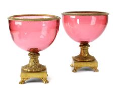 A PAIR OF CONTINENTAL PINK GLASS AND ORMOLU MOUNTED VASES
