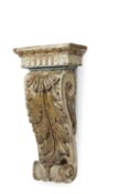 A CARVED GILTWOOD AND POLYCHROME CORBEL