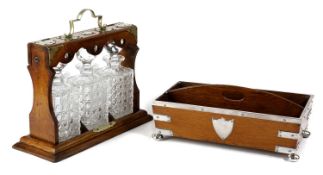 A LATE VICTORIAN OAK TANTALUS
