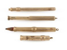 A collection of four gold pencils,