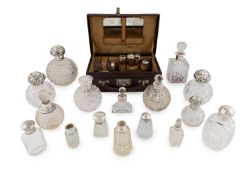 A collection of silver-mounted scent bottles,