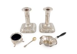 A pair of Edwardian silver dwarf candlesticks,