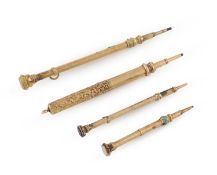 A small collection of four gold propelling pencils,
