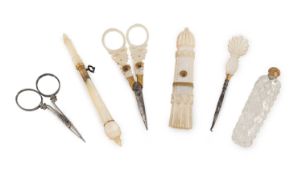 A collection of gilt-mounted mother-of-pearl sewing items,