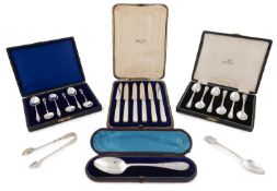 A small collection of silver flatware,