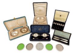 A collection of cased silver items,