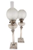 A pair of electroplated oil lamps,