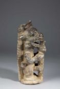 A SAPI STONE STANDING FIGURE