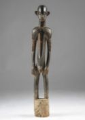 A SENUFO MALE POUNDER DEBLE