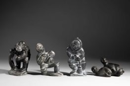 FOUR INUIT CARVED STONE FIGURAL GROUPS