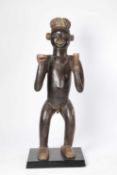 A KOM STANDING CHIEF FIGURE