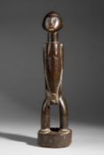 A NIGERIAN STANDING MALE FIGURE