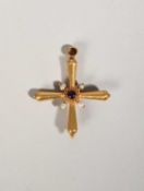 A GOLD CROSS PENDANT