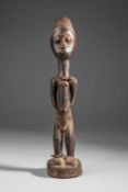 A BAULE STANDING MALE FIGURE