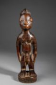 A YORUBA MALE IBEJI FIGURE