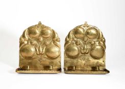 Arts and Crafts A pair of brass wall sconces
