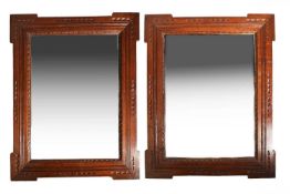 Liberty & Co. A pair of oak wall mirrors