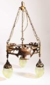 In the manner of W.A.S. Benson, An Arts and Crafts three-arm ceiling light