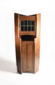 Attributed to Shapland and Petter, An Arts and Crafts corner cabinet