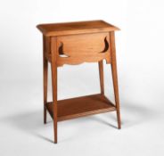 Attributed to Liberty & Co. An oak occasional table