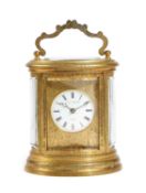 A GILT BRASS OVAL CARRIAGE CLOCK