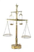 A SET OF FLOOR STANDING BRASS BUTCHER'S SCALES