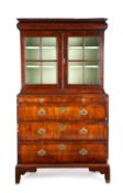A WALNUT AND STAINED PINE CABINET ON CHEST