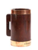 A GEORGE III TREEN LIGNUM VITAE AND COPPER BOUND MEASURE OR TANKARD