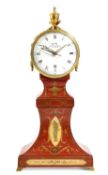 A REGENCY PAINTED AND GILT BRASS MANTEL CLOCK